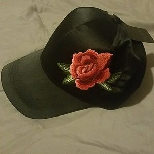 Black hat with red rose .